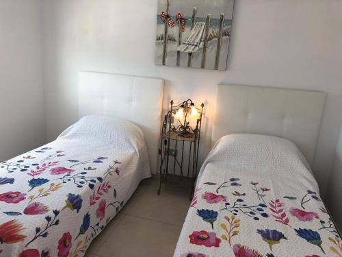 Ліжко або ліжка в номері Sunset View