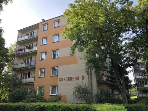 a building with a sign on the side of it at Apartament Chrobrego 269 in Biała Podlaska