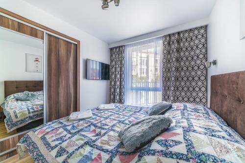 Posteľ alebo postele v izbe v ubytovaní Apartament Relax