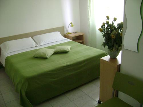 Postel nebo postele na pokoji v ubytování Albergo Moderno