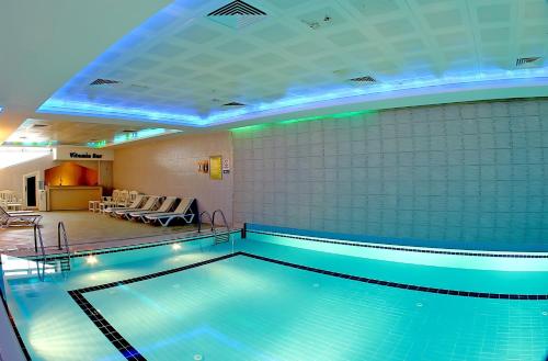 a large swimming pool in a hotel room at Seckin Hotel in Sakarya