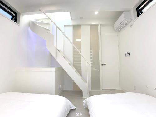 Кровать или кровати в номере HAKU HOTEL