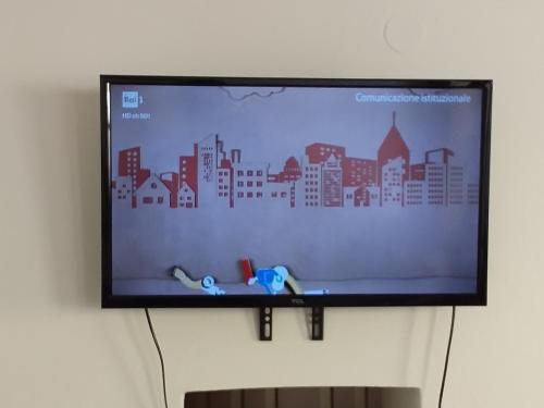 a flat screen tv hanging on a wall at Apartment Novigrad in Novigrad Istria
