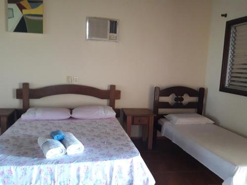 Un pat sau paturi într-o cameră la POUSADA SERRA DA CANASTRA