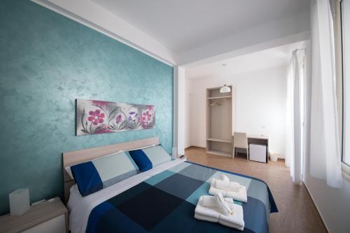 Ένα ή περισσότερα κρεβάτια σε δωμάτιο στο B&B San Michele