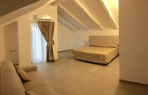Tempat tidur dalam kamar di Villa Donatella