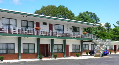 a building with a staircase on the side of it at Travelers Inn in Brunswick