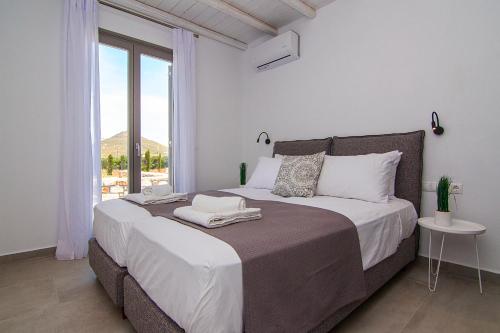 Postel nebo postele na pokoji v ubytování IL SOGNO VILLAS Paros