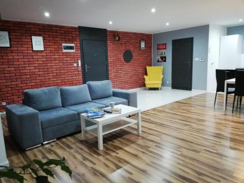 Posezení v ubytování Apartamenty koło Szczyrku A&S Spa - basen, jacuzzi, sauna