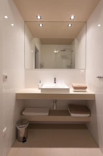 a bathroom with a sink and a mirror at Sofie Apartments in Vienna