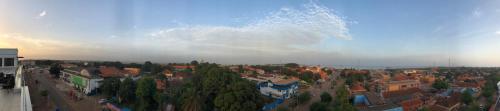an aerial view of a city with trees and buildings at Bissau Royal Hotel in Bissau