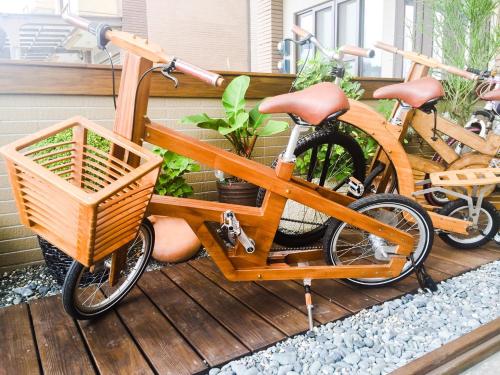 two bikes are parked on a deck at Ciao Home in Toucheng