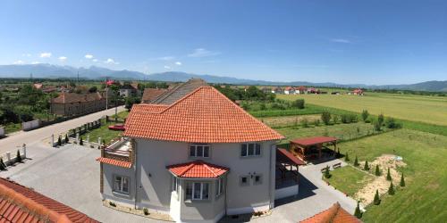 an aerial view of a house with an orange roof at Absolut Residence Hateg in Haţeg