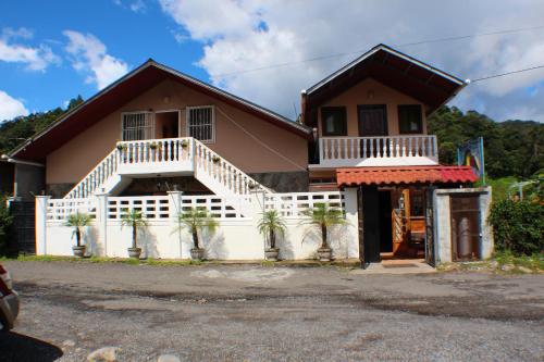 a house with a white at Hostal Boquete in Boquete