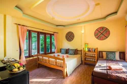 Postel nebo postele na pokoji v ubytování Seaboard Bungalow