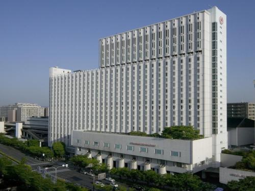 a large white building with a lot of windows at Sheraton Miyako Hotel Osaka in Osaka