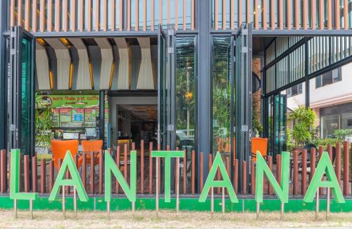 a sign for a restaurant in front of a building at Lantana Pattaya - SHA Extra Plus in Pattaya North