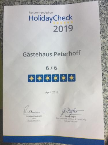 a sign for the holiday check for the gatsby petticoatactor at Gästehaus Peterhoff in Düren - Eifel