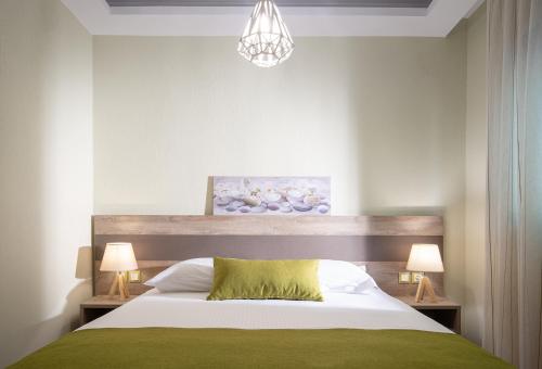 Ένα ή περισσότερα κρεβάτια σε δωμάτιο στο Aelia suites