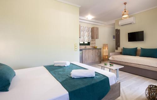 Ένα ή περισσότερα κρεβάτια σε δωμάτιο στο Aelia suites