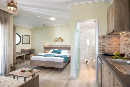 Ένα ή περισσότερα κρεβάτια σε δωμάτιο στο Aelia suites