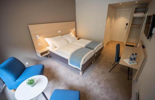 Postel nebo postele na pokoji v ubytování Lærdal Hotel