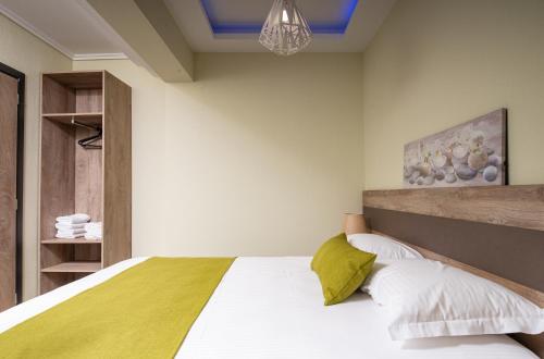 Ένα ή περισσότερα κρεβάτια σε δωμάτιο στο Aelia suites
