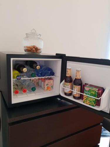 an open refrigerator with food and drinks in it at B&B Il giardino degli incanti in SantʼElpidio a Mare
