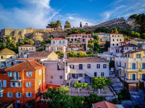 a cityscape of a town with the acropolis at Aethra Boutique Rooms in Nafplio