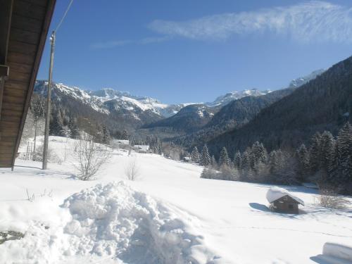 a pile of snow on the side of a house at Maso Pin in Madonna di Campiglio