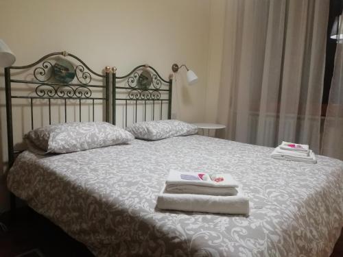 a bedroom with a bed with towels on it at B&B Murgantia in Morcone
