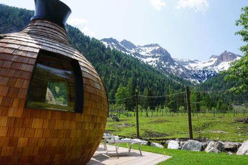 a building with a window on top of a field at Alpengasthof Gern Alm in Pertisau