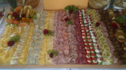 a display of different types of food on a table at Penzion Volyňka in Vimperk