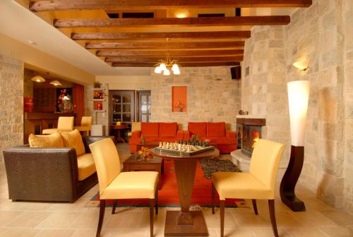 a living room with a couch and a fireplace at Mikri Arktos in Elati