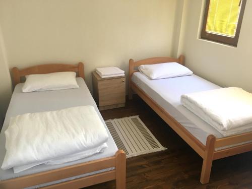 Postel nebo postele na pokoji v ubytování Apartment Kaneo