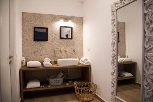 a bathroom with a sink and a mirror at Villa LeSunLuka Lefkada in Vasiliki