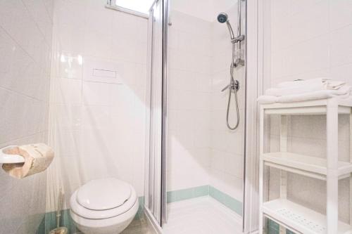 a bathroom with a shower and a toilet at Residence Calavà in Gioiosa Marea