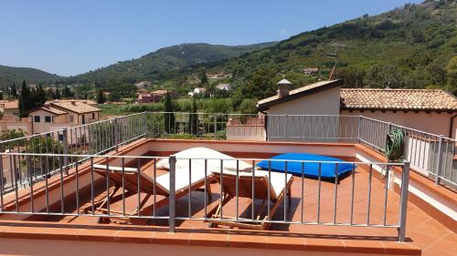 a balcony with a view of a mountain at Villa Sofia in Marina di Campo