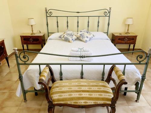 Uma cama ou camas num quarto em Giardino Marino