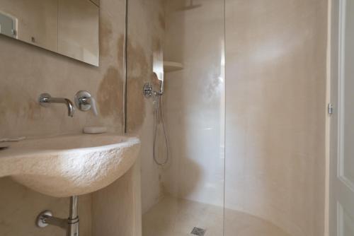 a bathroom with a sink and a shower at A casa di Dany in Polignano a Mare