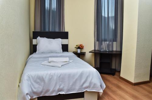 Postel nebo postele na pokoji v ubytování Gelati Tower