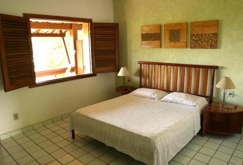 Cama ou camas em um quarto em Pousada Girassol