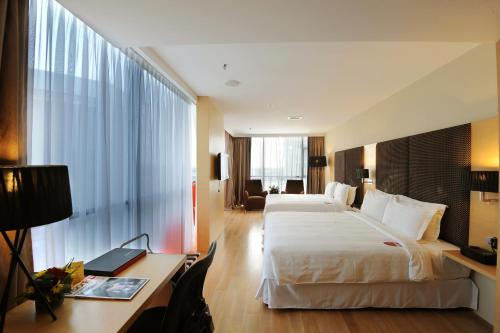 Katil atau katil-katil dalam bilik di Empire Hotel Subang