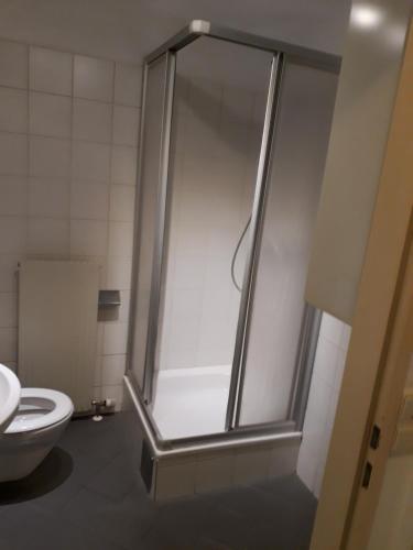 a shower stall in a bathroom with a toilet at cute Metro U4 in Vienna