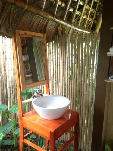 a bathroom with a bowl sink and a mirror at Thai Binh Garden in Thái Bình