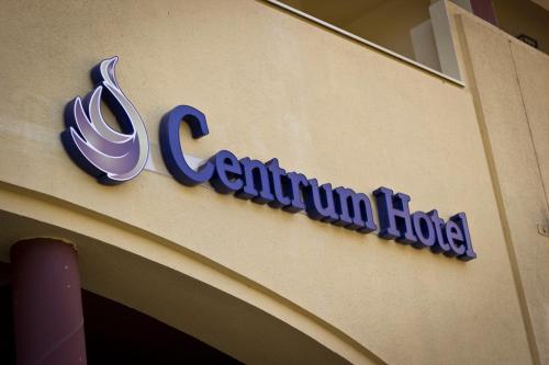 a scientology sign on the side of a building at Centrum Hotel in Debrecen
