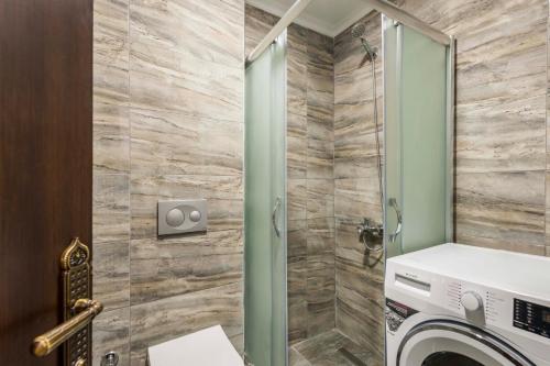 a bathroom with a washer and dryer at Element Garden in Istanbul