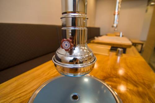 a bathroom sink with a faucet on a wooden counter at Hyundai Elliot Hotel and Resort in Pyeongchang