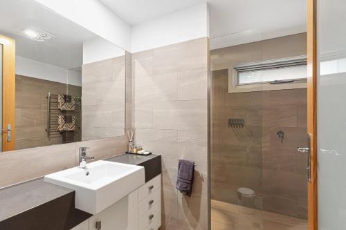 a bathroom with a sink and a shower at Frewville 7 Apartment in Mount Gambier