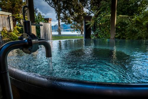 a hot tub with a water fountain at Tasman Holiday Parks - Te Anau in Te Anau
